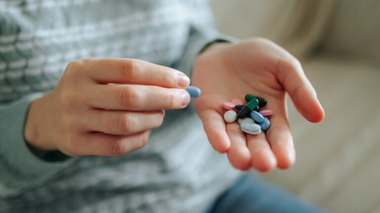 Child with medications in hand