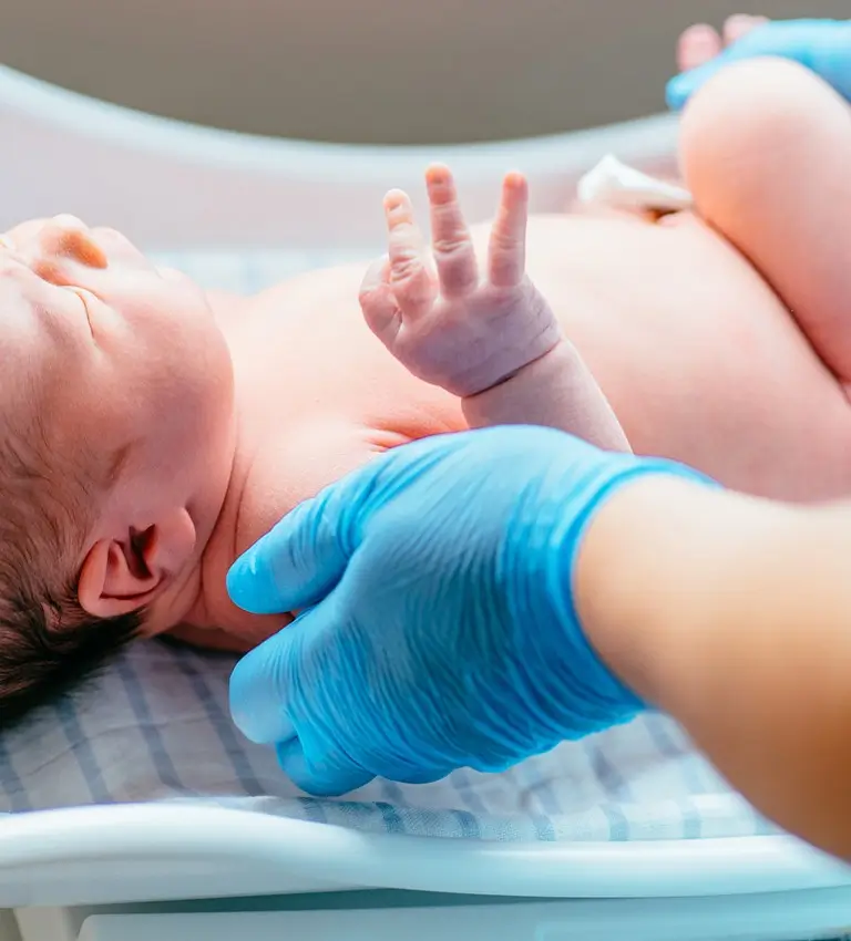 a baby in a hospital bed
