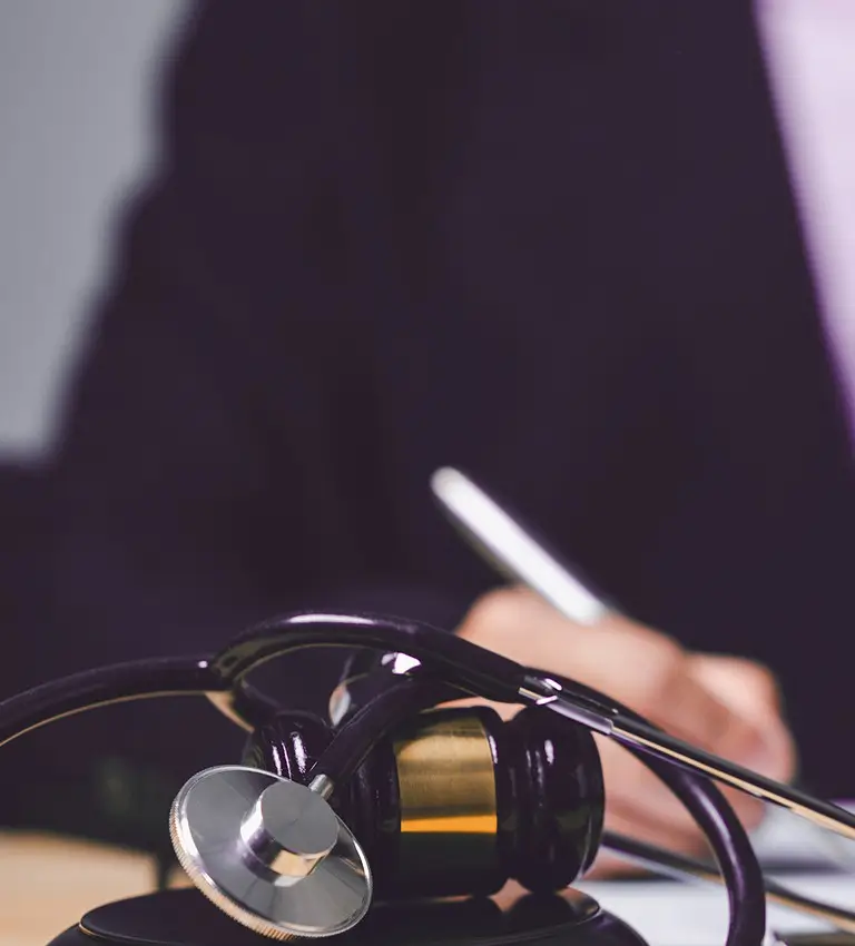 a doctor working on a laptop
