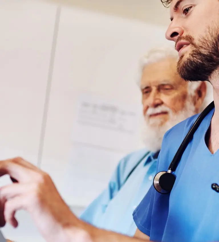 a doctor looking at a tablet