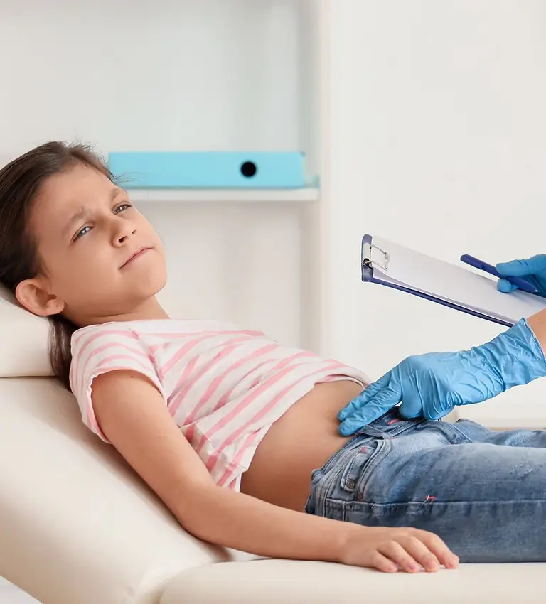 a young girl being examined by a doctor