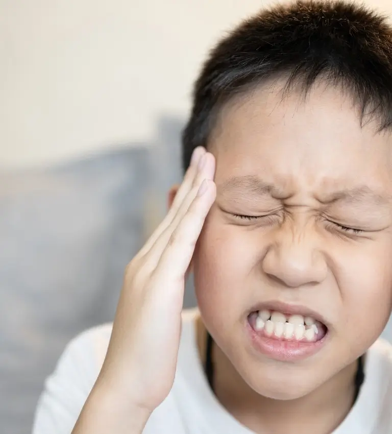 a boy with a headache