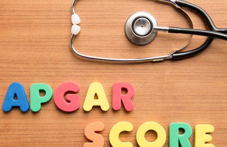 Apgar score colorful word with stethoscope on the wooden background