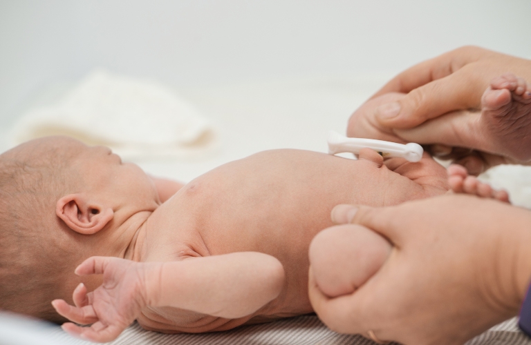 Nurses perform aspiration, testing and examination of a newborn after birth