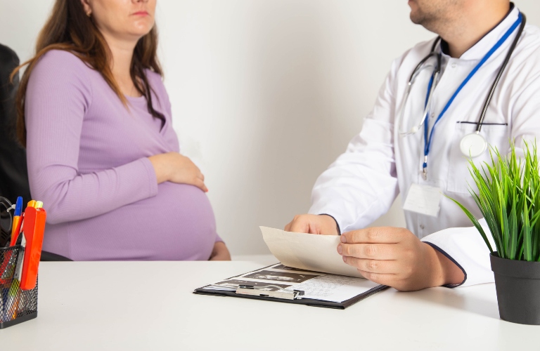 Pregnant girl in the doctor's office