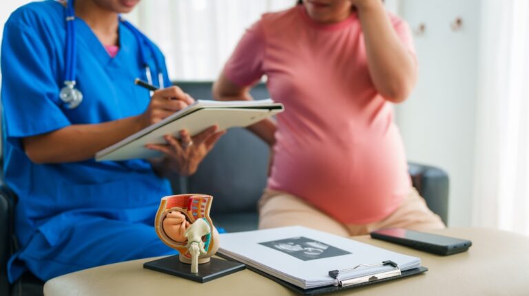female doctor consult pregnant woman